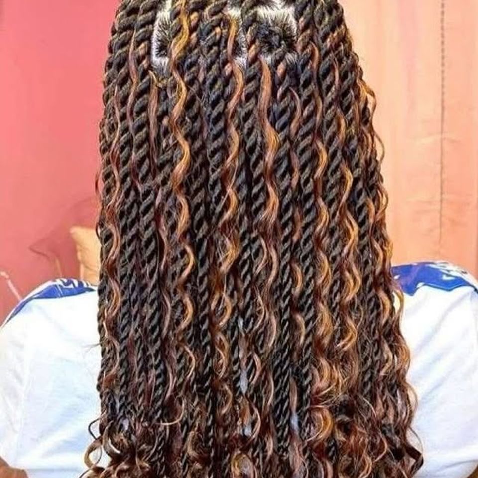 Long passion twists with brown highlights and curly texture after a braiding service in Los Angeles CA
