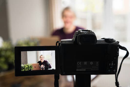 Person having their photo taken a photo of the screen of the photo is displayed 