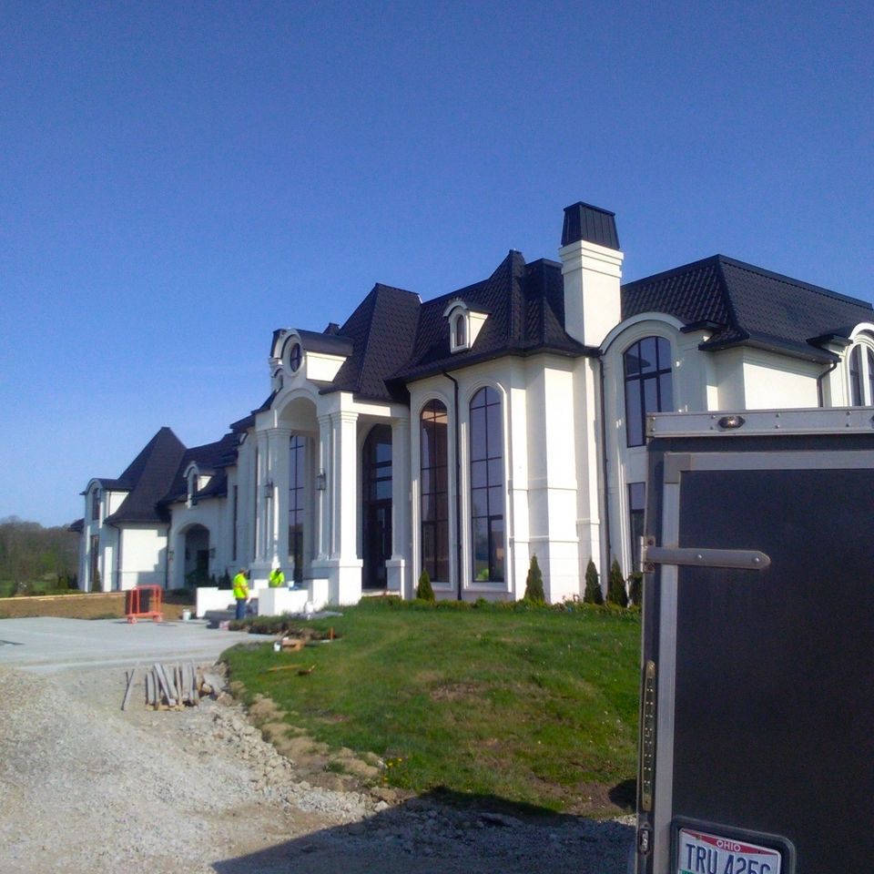 Large white luxury home exterior during an interior remodeling project in Chagrin Falls Ohio
