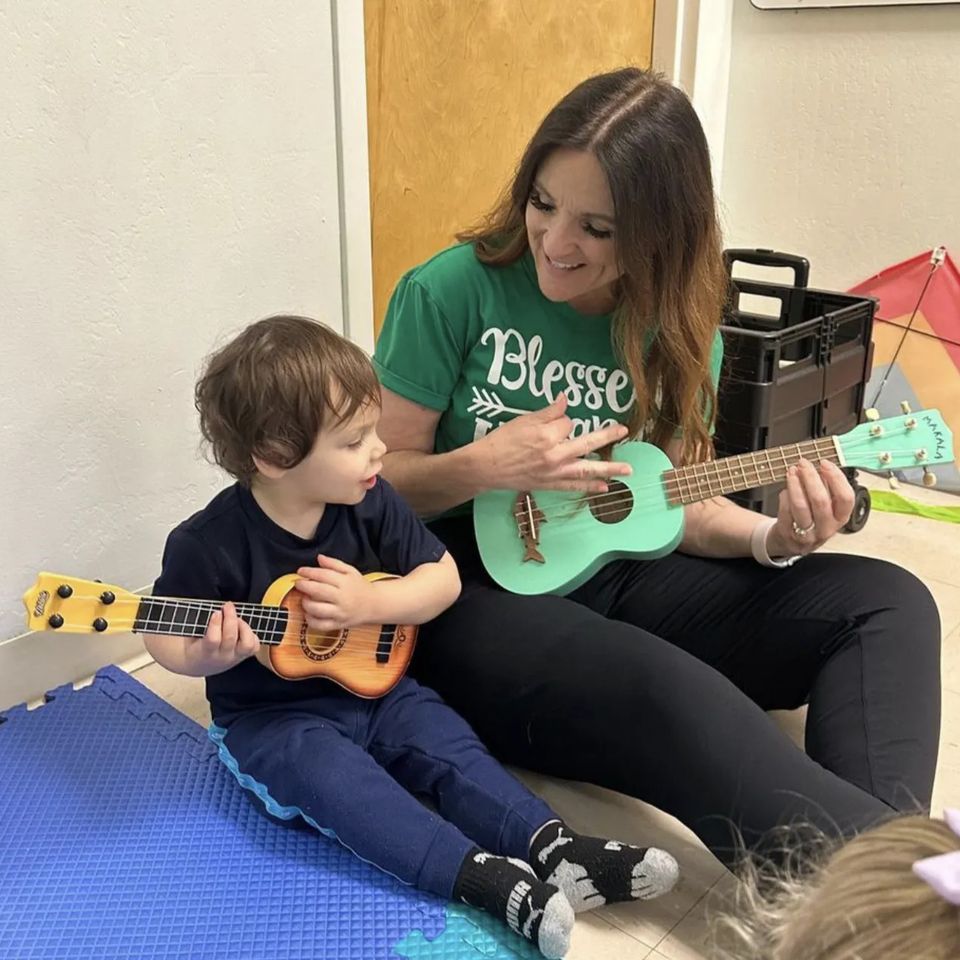 Miss Claire Teaching Ukulele