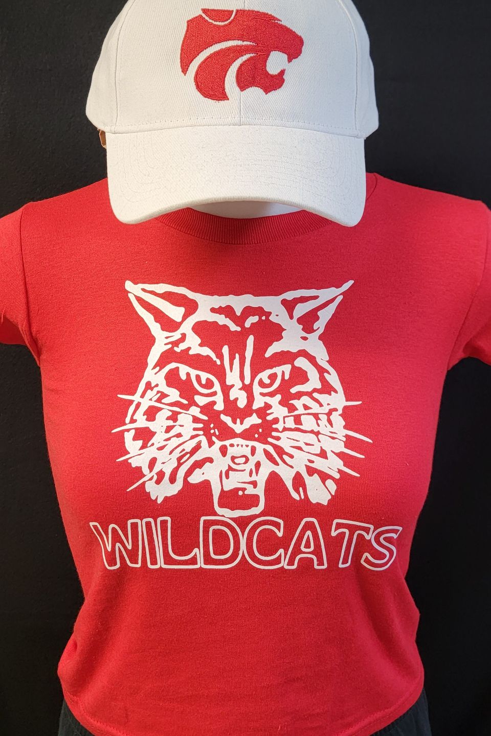 Example of Direct to Film (DTF) transfer - alternate Wildcats alternate logo on a red t-shirt, embroidered logo on white cap 