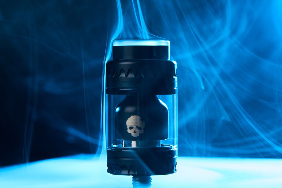 Smokey screw-on vape tank on a black background