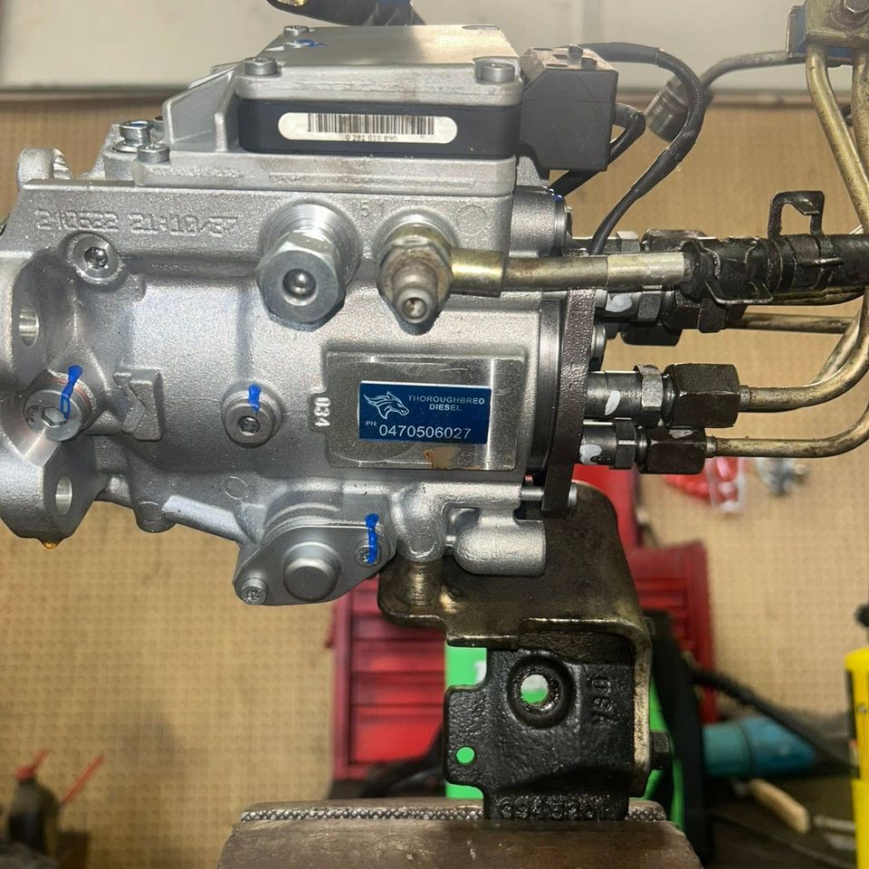Rebuilt Bosch VP44 diesel injection pump mounted in vise during service in Arab Alabama