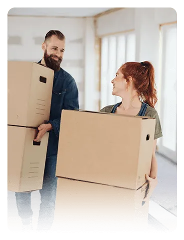 Two people moving boxes