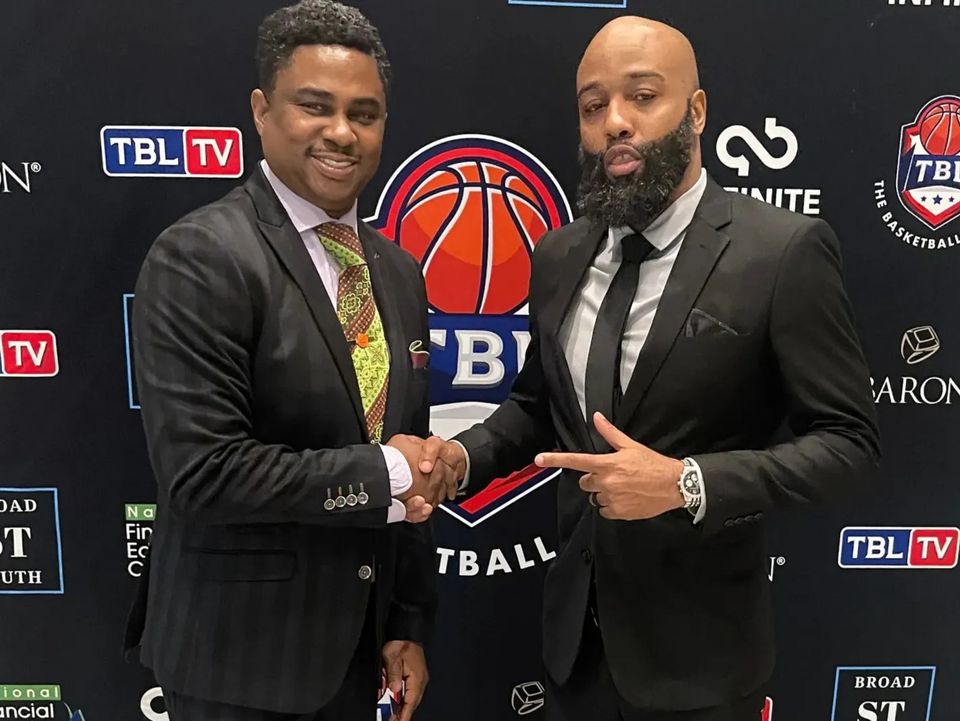 Jacksonville 95ers Owner Kevin Waters shaking hands with GM of Basketball Operations Dwayne Joshua