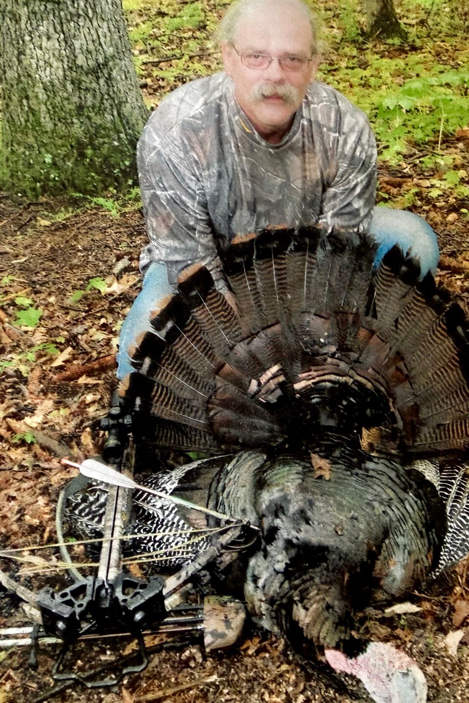 Tim Martin showing the turkey he shot with a crossbow.