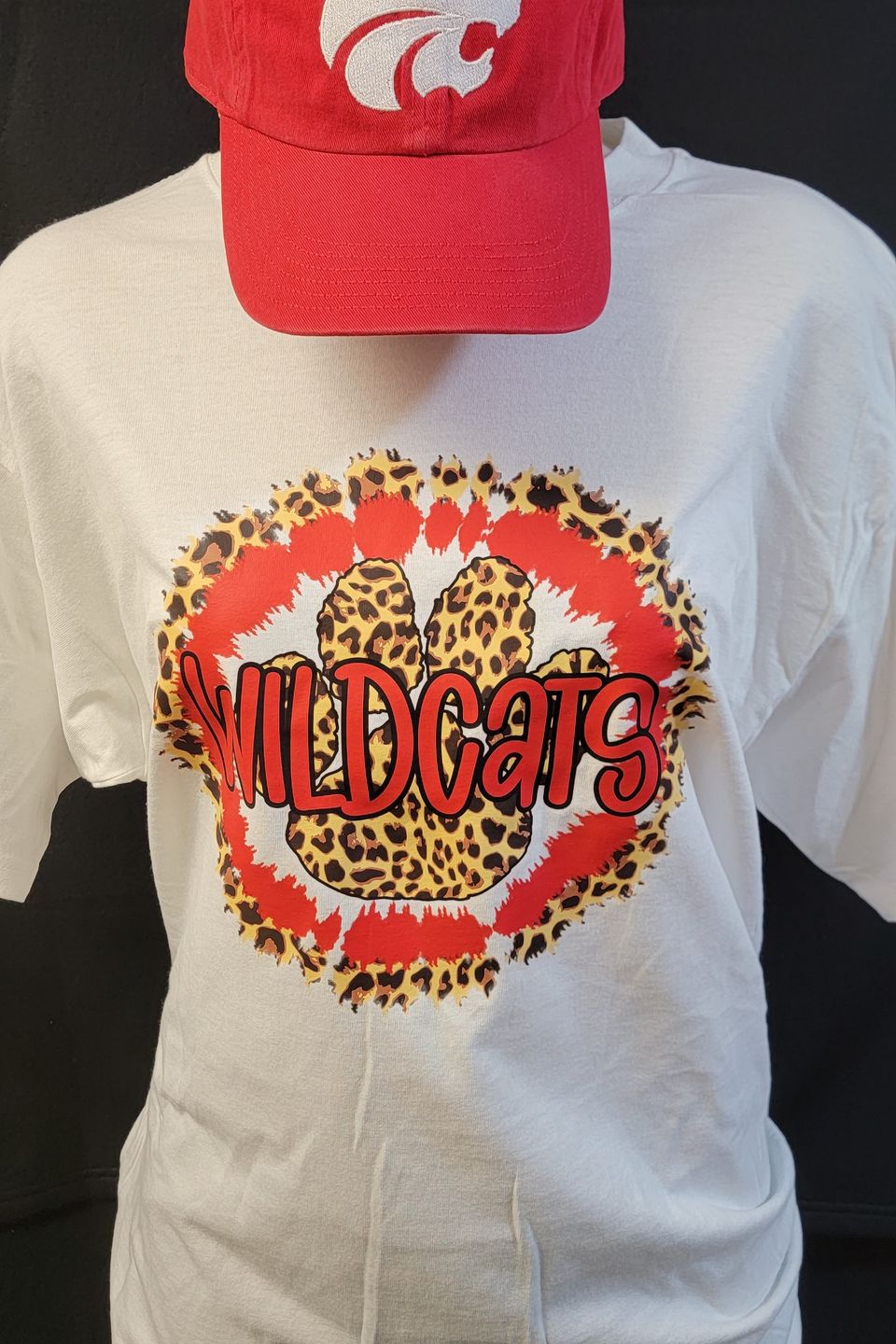 Example of Direct to Film (DTF) transfer - Wildcats logo on a white t-shirt, & embroidered cap,