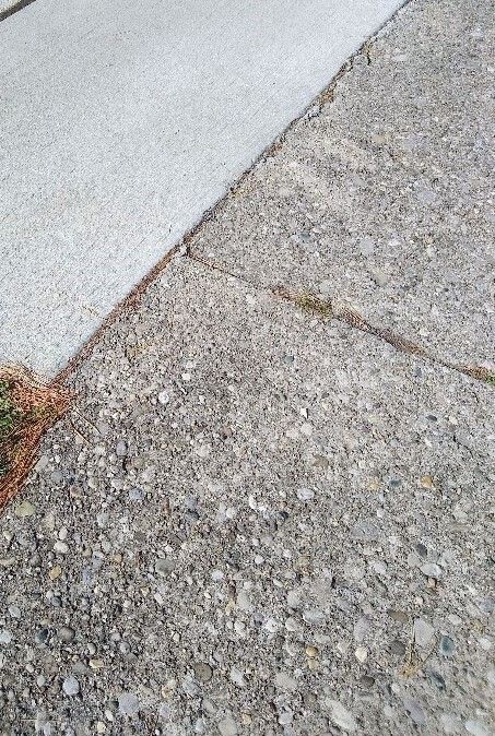 Spalled sidewalk 