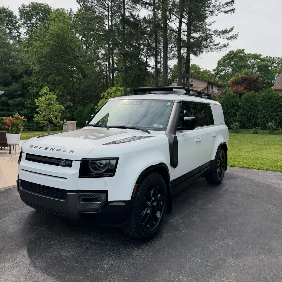 White Land Rover Defender with satin hood decal and glossy paint after exterior cleaning at a Wilmington DE home