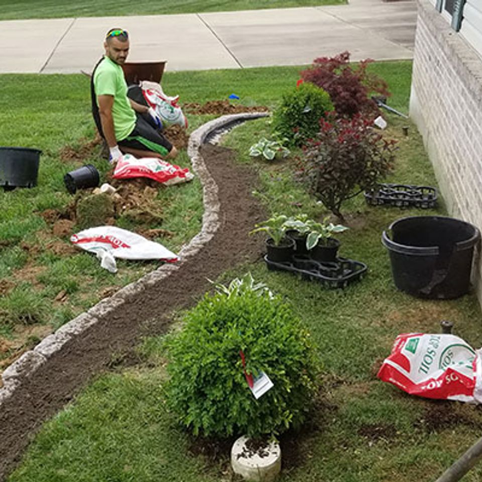 Beautiful landscaping services candid land maintenance
