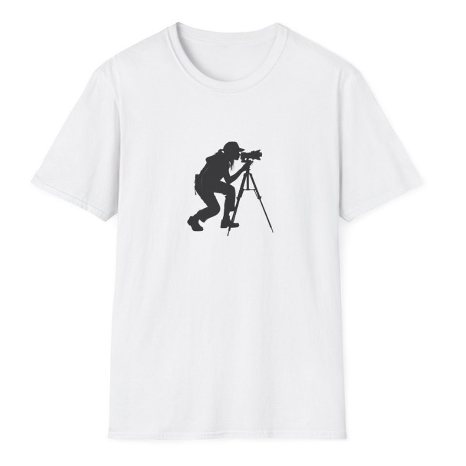 Woman photogarpher intent on filming from her tripod image on a t-shirt
