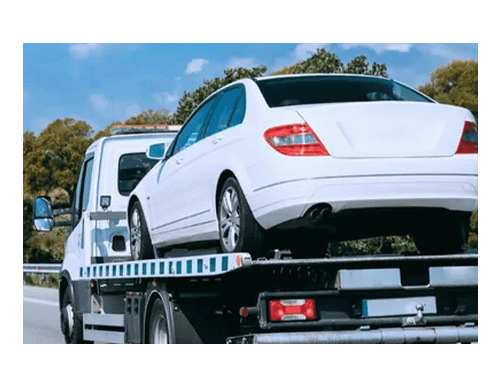 White sedan on tow truck