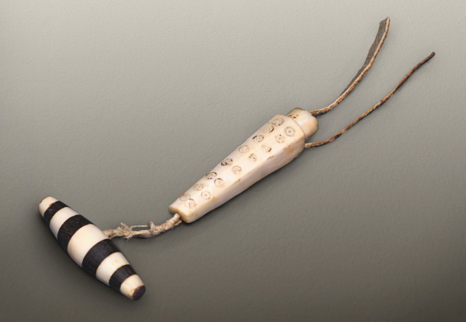 Bird bone needle with sinew thread