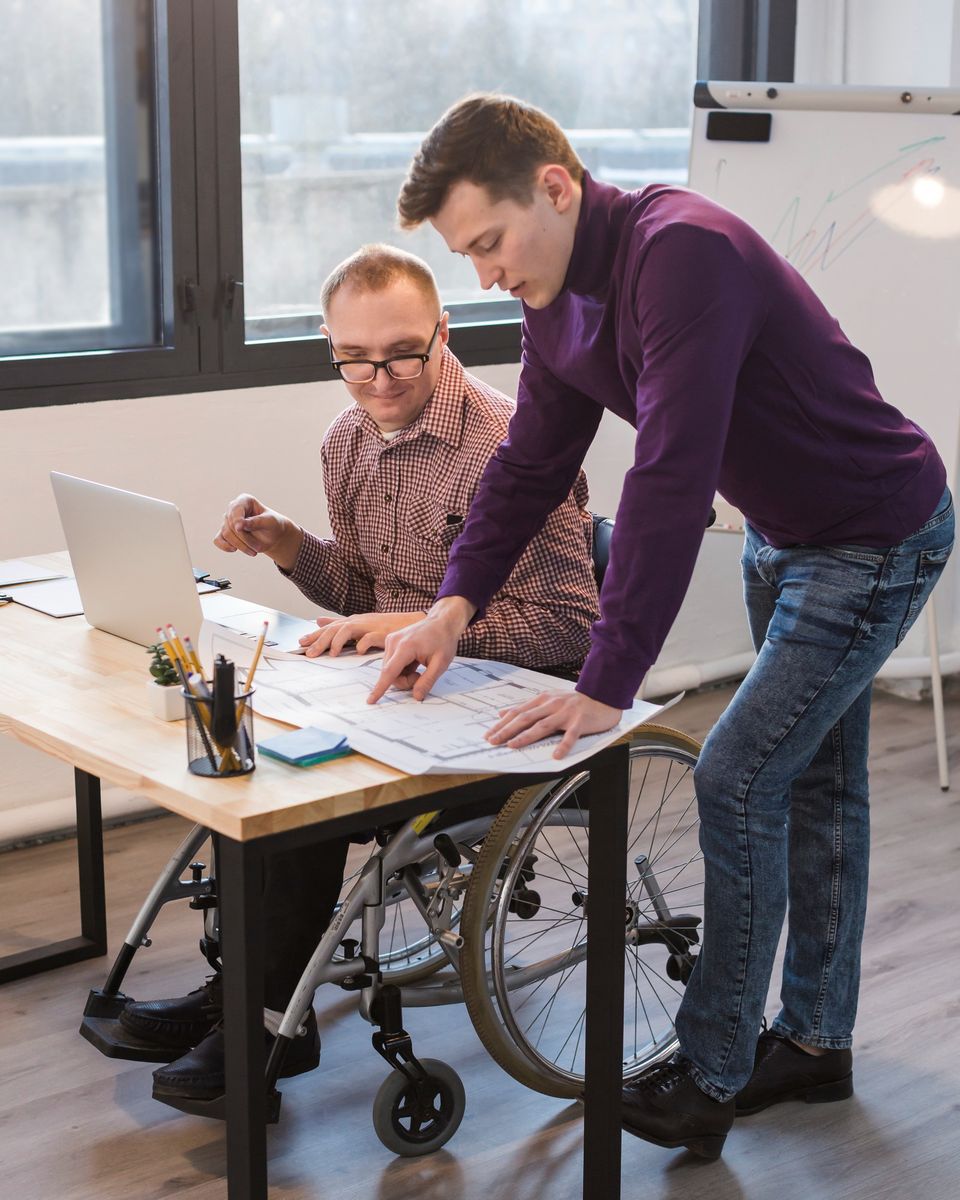 Manager working together with disabled man