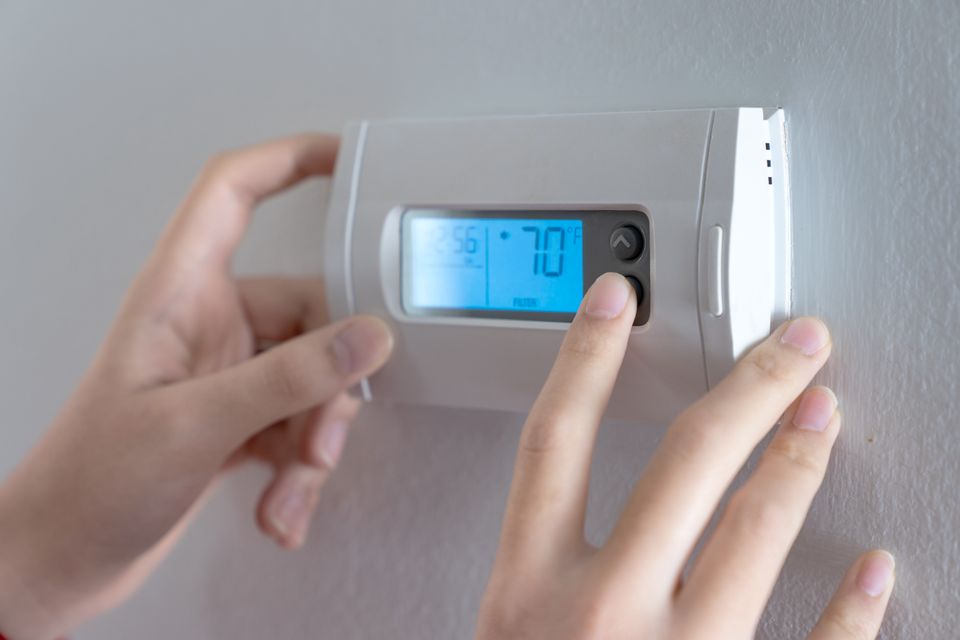 Hand press indoor room thermostat lower temp