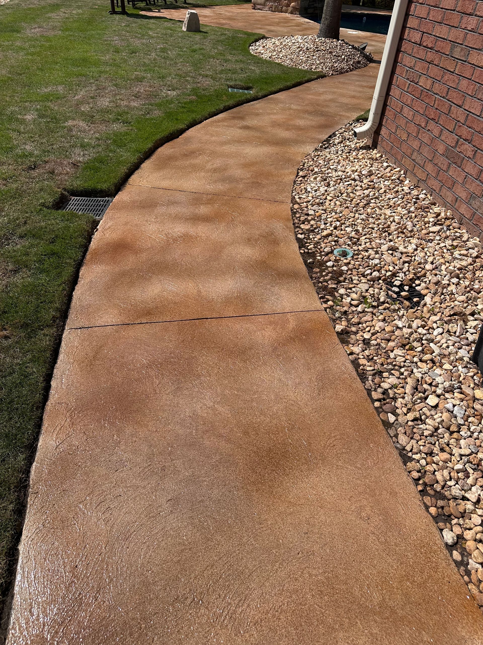 After photo of decorative concrete walkway connected to Evans GA pool deck area