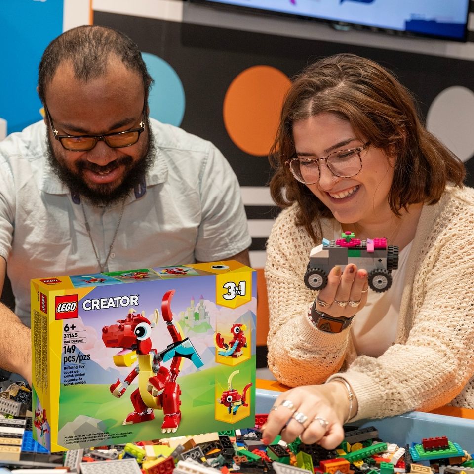 Two people enjoying the PlayWorks Adventure Lego adult field trip