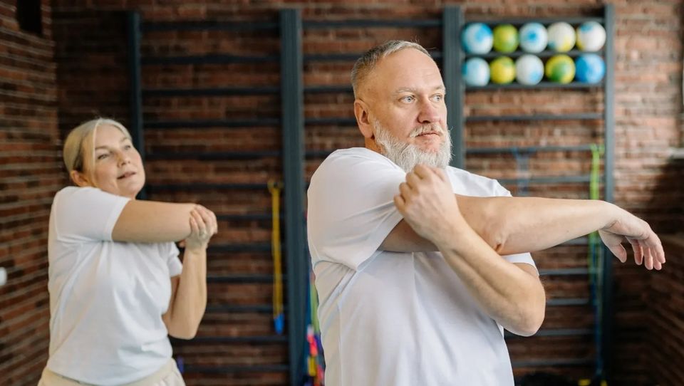 Adults improving mobility and confidence through wellness coaching