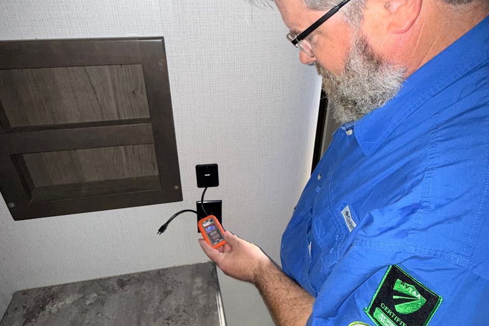 John Glass of RV Clarity performs test of USB outlet.