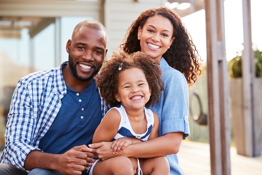 Bigstock young black family embracing o 236699197