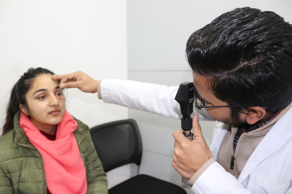 Teen getting her eye exam at a family eye-care center