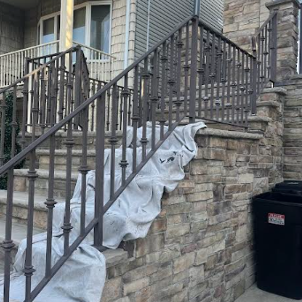 Careful prep of surface before railing repaint in Bayonne, NJ