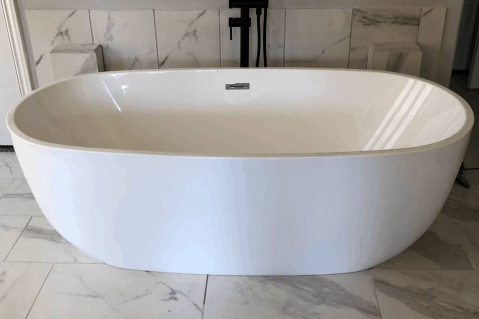 Freestanding soaking tub installed during a Spring TX bathroom remodel