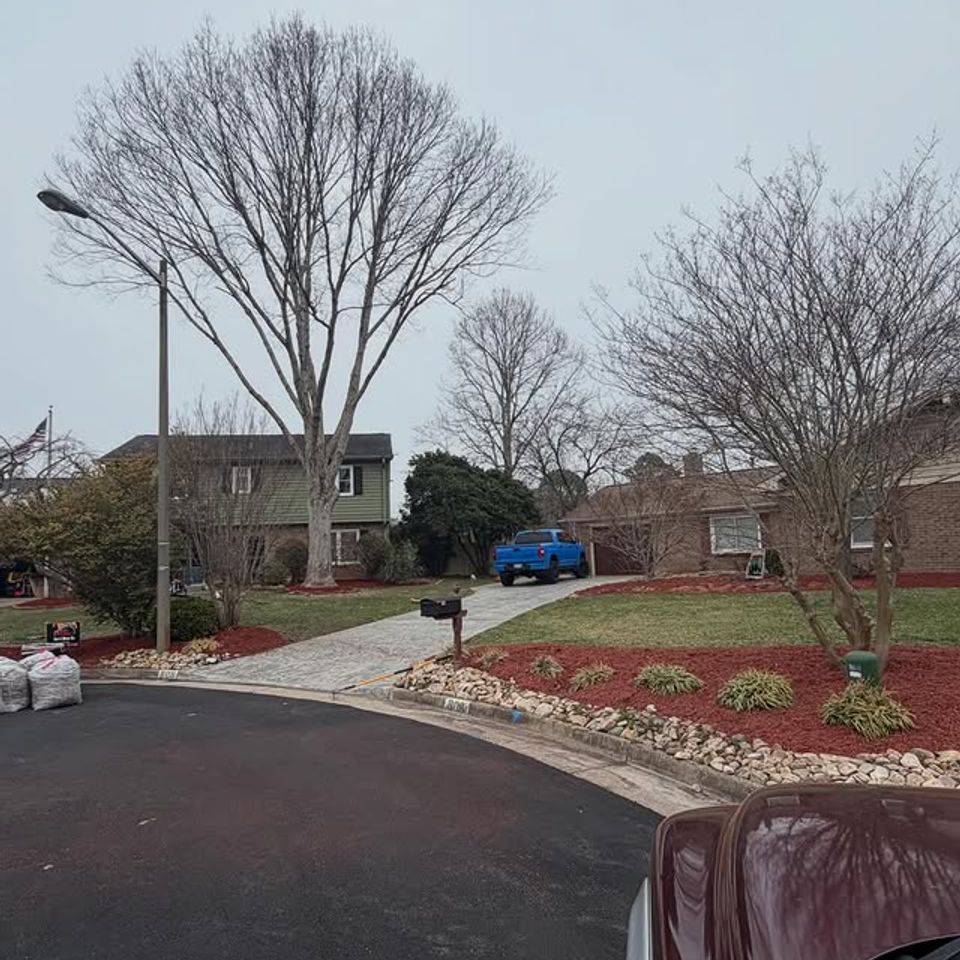 Far shot of mulching services for a house, done by Get A Mow On Lawn Care LLC of Chesapeake VA