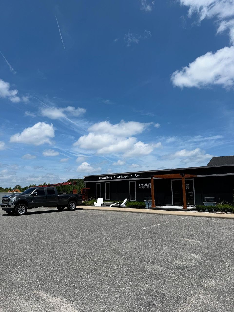 Evolve Design and Build showroom with tinted storefront windows in Moyock North Carolina