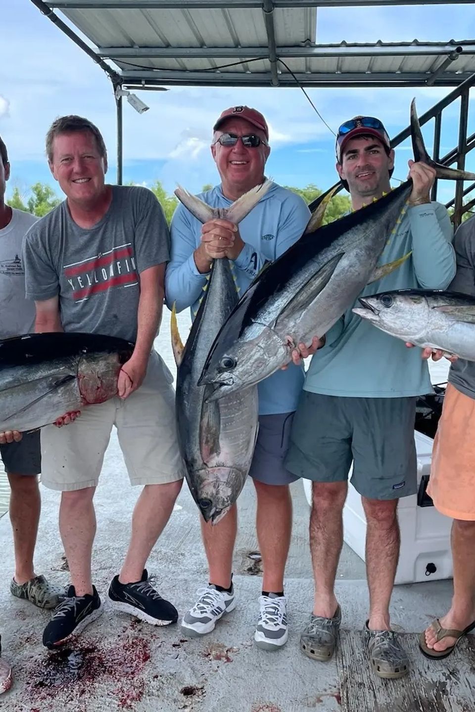 Private New Orleans fishing charter guests posing with large fish caught offshore.