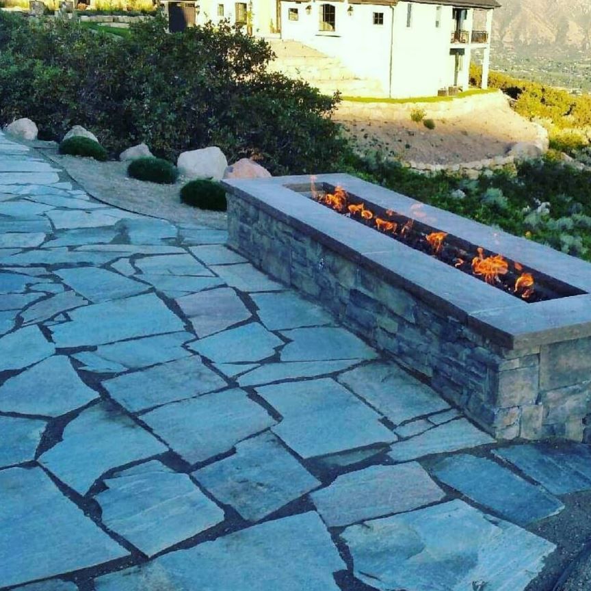 A working and newly installed fireplace by Ho/Gar Hardscapes