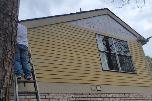 Fresh fiber‑cement lap siding installed over new sheathing in Houston, TX