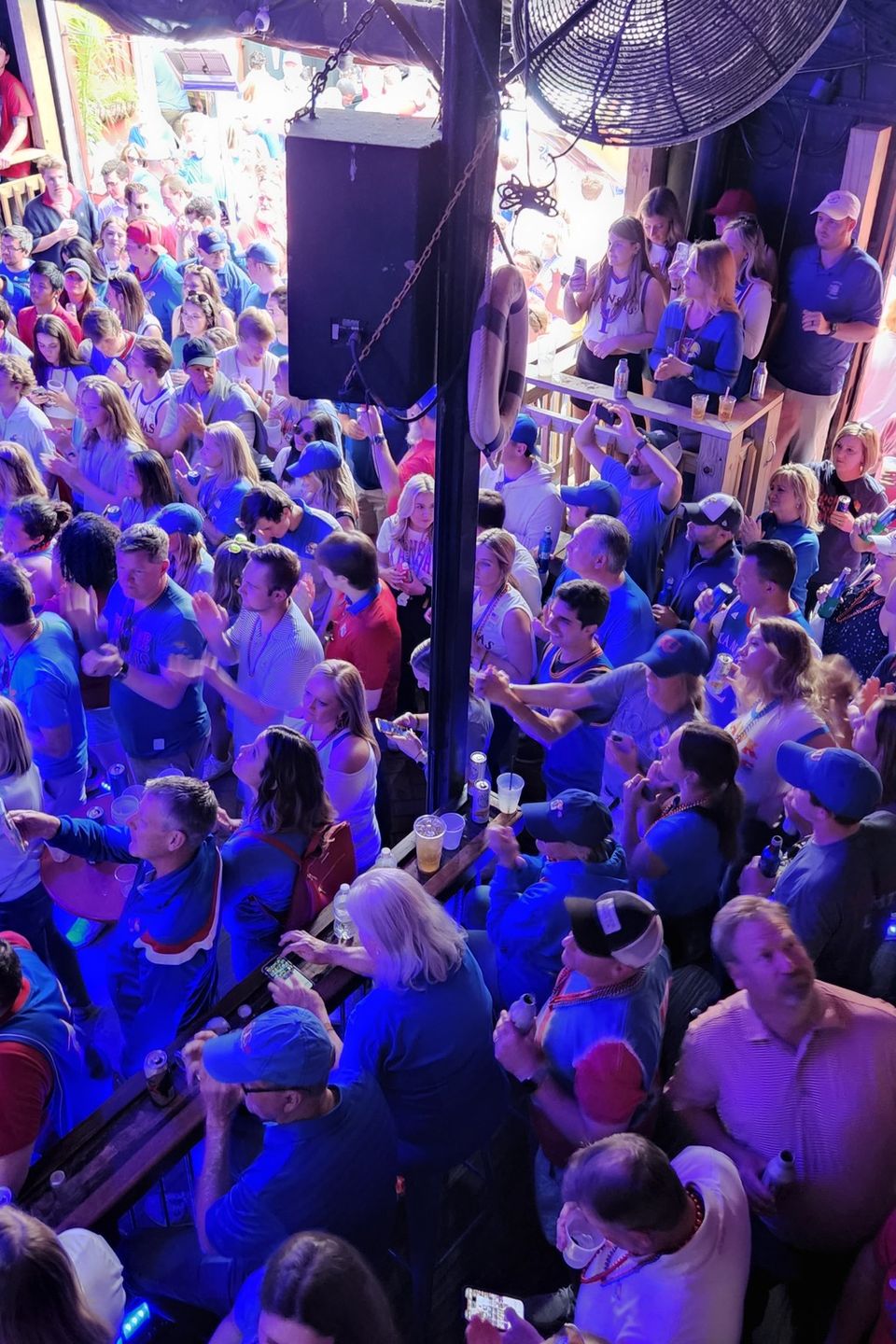 Crowd of fans gathered inside a Bourbon Street venue during a Carpe Diem Events pre-game fan party in New Orleans
