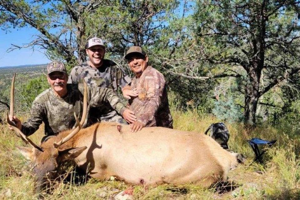 Phillip kolesch with his son ryan and guide mando 2021 with phllip's bull 2021