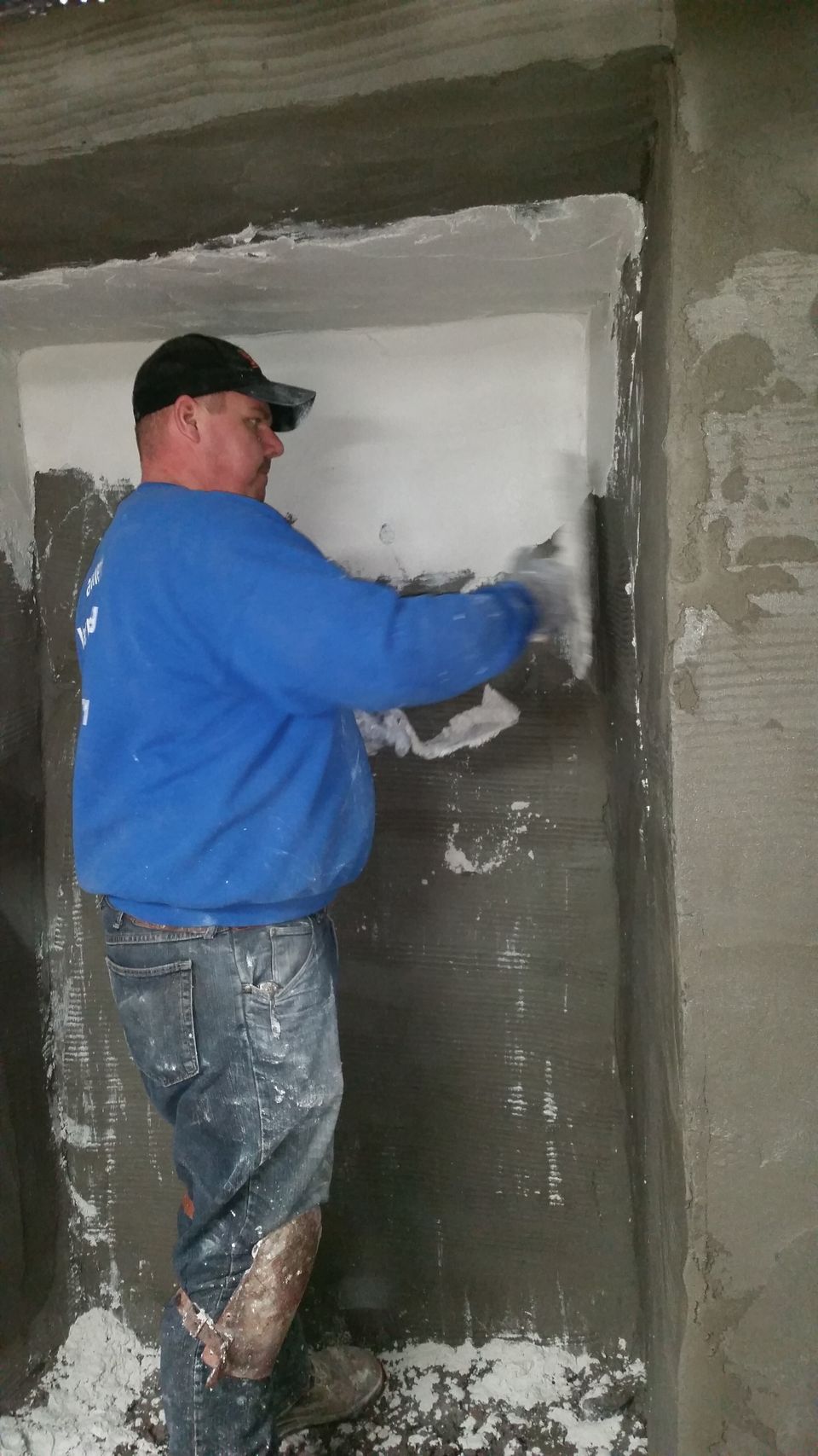 (6) charlie putting 2nd coat of rough casting