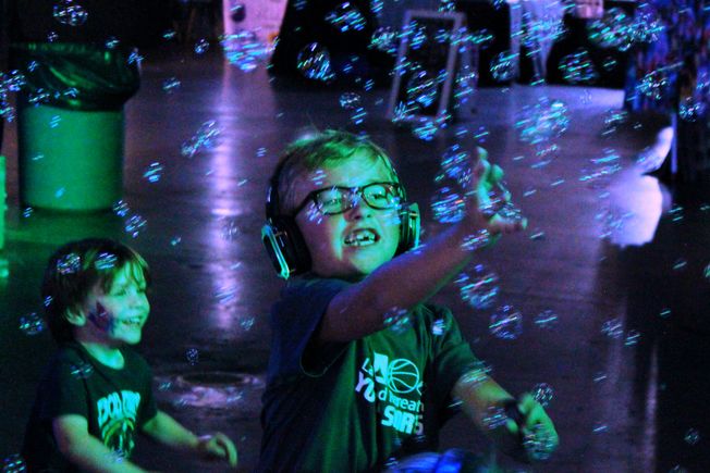 Child playing with bubbles