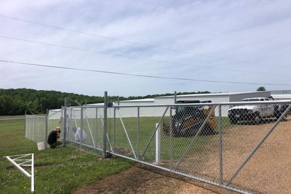 Dore family installing chain link automatic gate