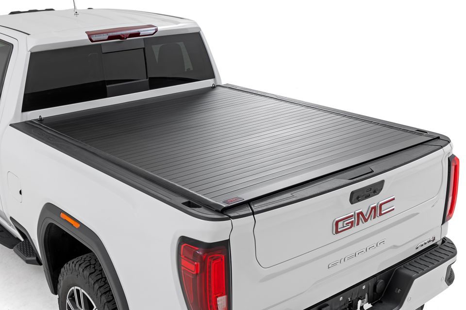 White GMC Sierra bed cover