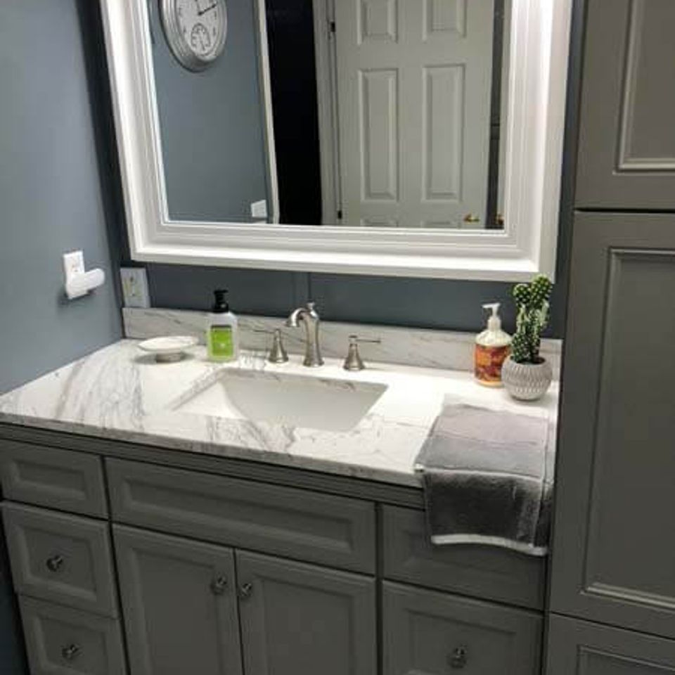 Elegant bathroom remodeling project with marble countertops and custom cabinetry in Knoxville TN