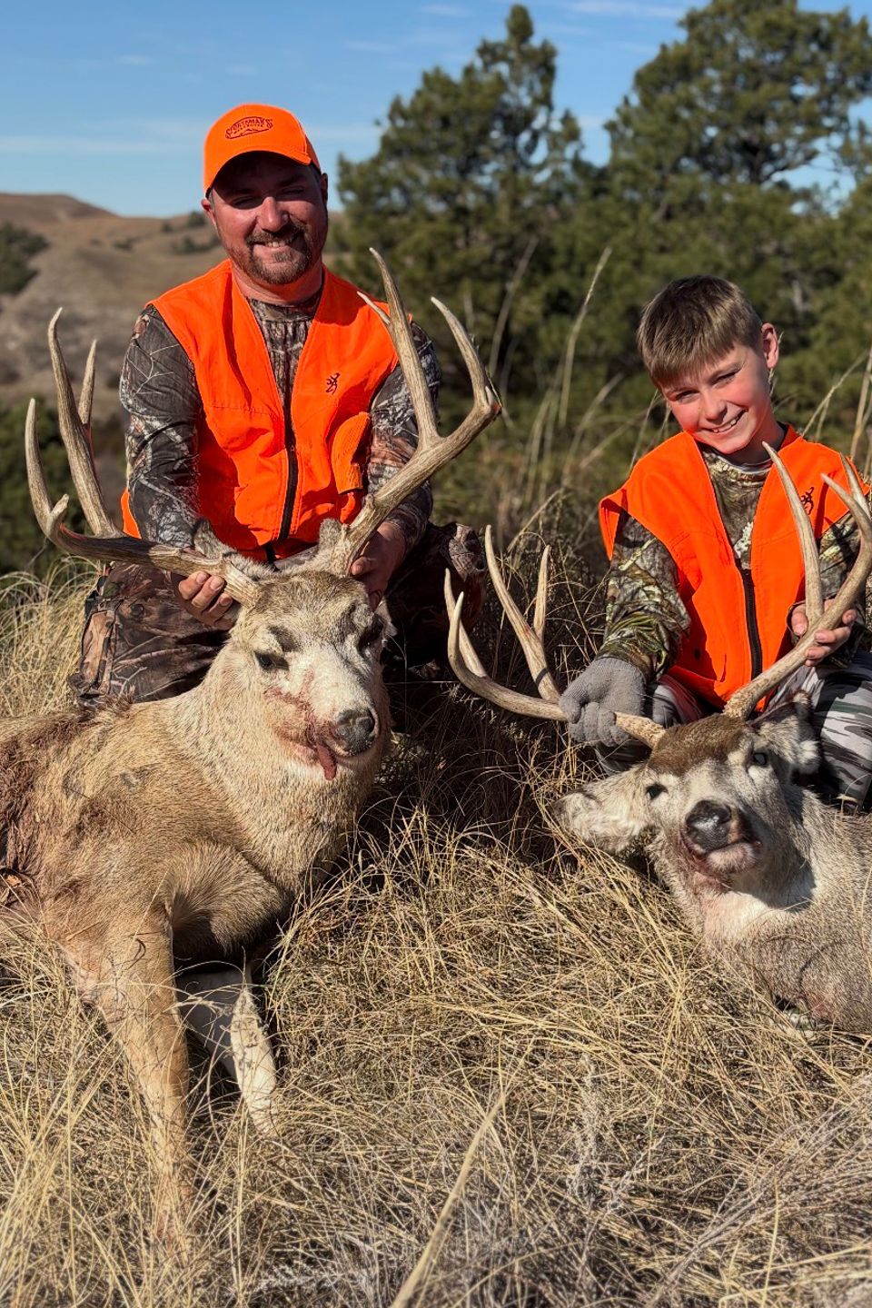 Brandon and 10 year-old Blake Smith from Lewisberry, with the mule deer and white tail deer they bagged on Blake's first hunting trip to Merrimack, Nebraska 