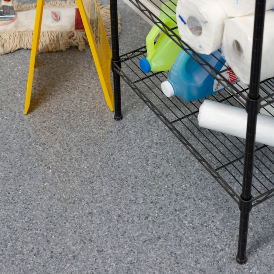 Utility room featuring EverStone Flakes flooring.