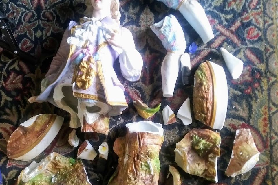 Broken porcelin doll statue