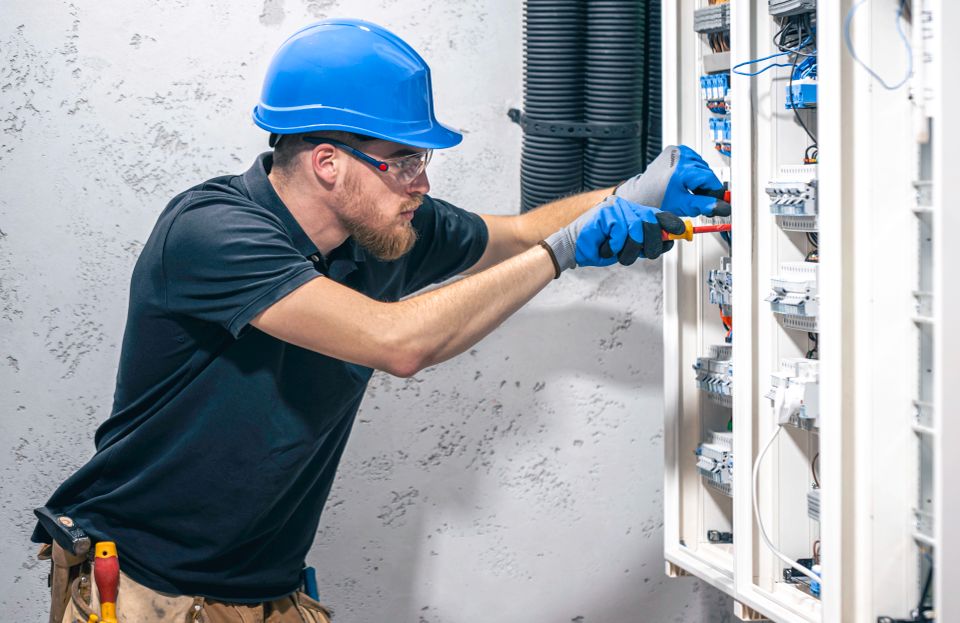 An electrician at work on a project