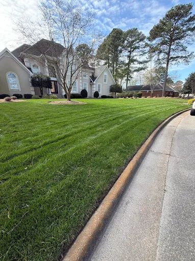 Far shot of cut grass for a client, done by Get A Mow On Lawn Care LLC of Chesapeake VA
