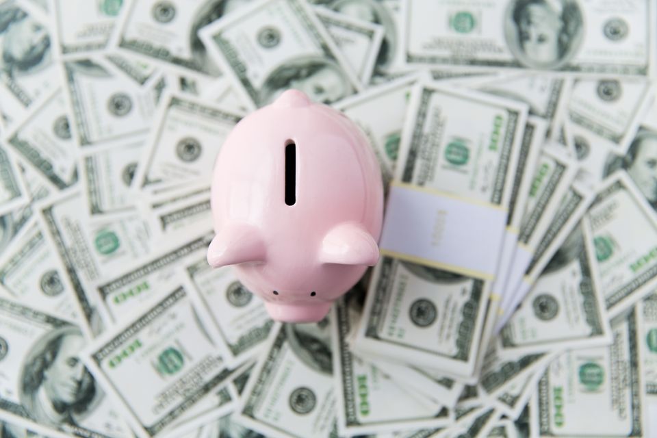 Piggy bank and dollars for air conditioning savings depositphotos 83338316 xl 2015