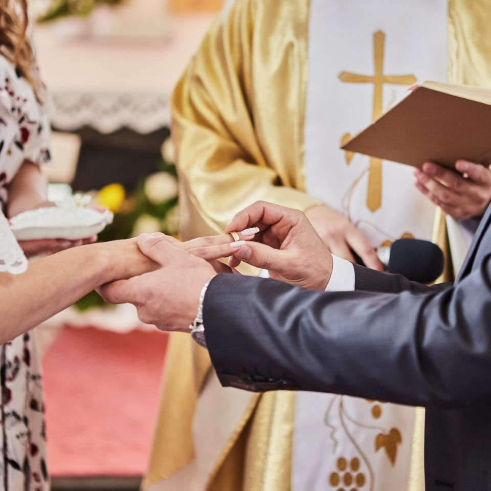 Religious wedding ceremony with couple exchanging vows in a spiritual setting in Bronx, NY