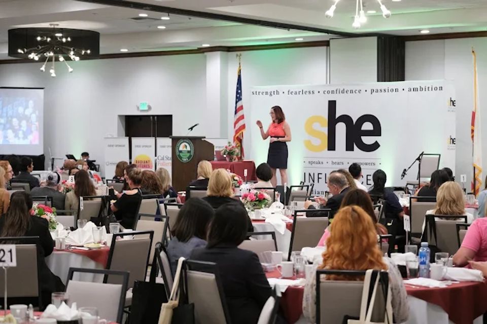 woman speaking to a group of people