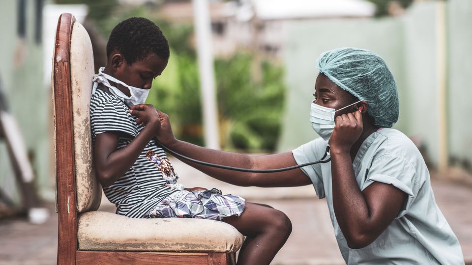 African american boy getting checkup by doctor min