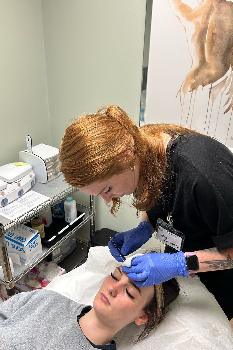 Esthetician student performing facial treatment in skincare training program