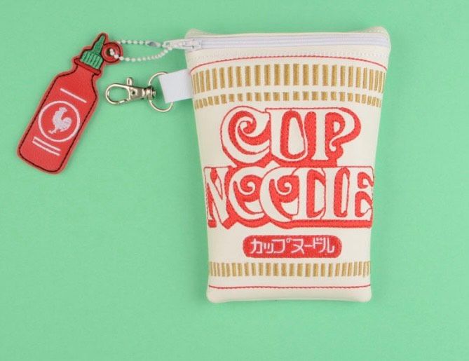 Custom embroidered zipper pouch featuring a Cup Noodles-inspired design with decorative keychain attachment.